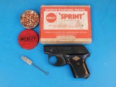 A Webley & Scott 'The Sprint' starting gun with caps and brush in original box
