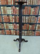 A mahogany jardiniere stand with turned spiral twist stem raised on a carved tripod base (135cm