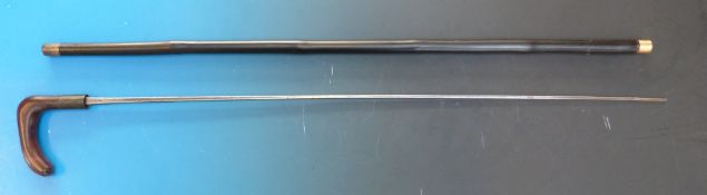 A Wilkinson sword stick with carved handle, stamped to the square tapering section blade