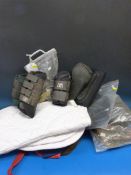 16 sets of assorted brushing boots together with three small dog coats, eight dressage sheets and