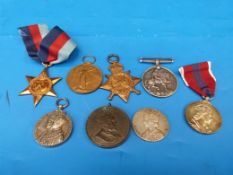 A group of WW1 and WW2 medals including coronation medals, WW2 stars, 1914 - 18 medal and Victory