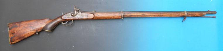 A 19thC muzzle loading rifle with captive ramrod, engraved decoration and chequered semi pistol