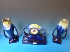 A French ceramic Art Nouveau clock garniture, c1900
