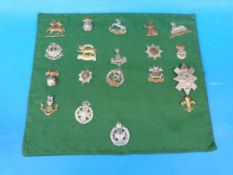 Nineteen British Army cap badges to include Norfolk Regiment, Royal Lincolnshire, Hampshire,