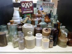 A collection of stoneware and glass bottles including Batey, White, London Co-op and others,