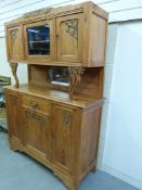 A pine dresser with carved decoration (W140cm x D46cm x H190cm)