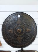 A Victorian cast iron wall shield with bronze painted highlights and decoration of classical style