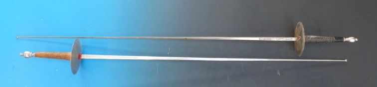 A pair of narrow bladed swords marked Toledo to the blade