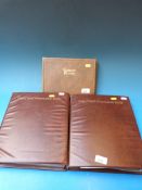 Two albums of GB presentation  packs and an album of cigarette cards