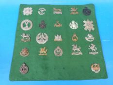 Twenty-two various British Army cap badges, WW1 / WW2, mostly territorial regiments including