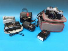 A Minolta camera in case with lens together with another three examples including a Kodak