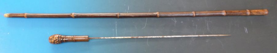 A bamboo sword stick or cane with square tapering blade