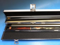 A BCE Heritage Collection snooker cue with two extensions in a Jimmy White custom cue case and a