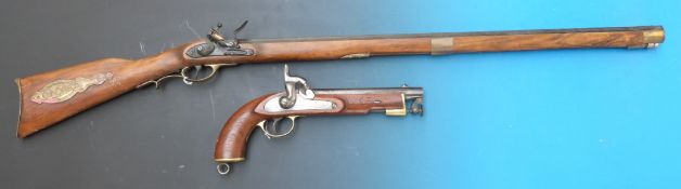 A replica percussion pistol with hinged captive ram rod together with replica flintlock gun