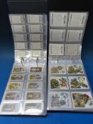 Six albums containing sets and part sets of Players and Wills cigarette cards including Cricketers,