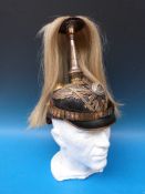 A WWI German officer's pickelhaube with enamel central medallion and Suum Cuique motto, the spike