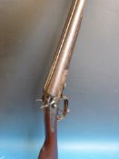 An EC Green & Son 12 bore double barrelled side by side hammer action shotgun with ornate engraving