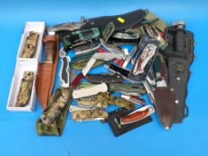 A large collection of various knives