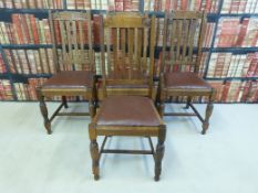 A set of four carved oak dining chairs with drop in upholstered seats