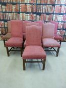 A set of eight upholstered mahogany dining chairs