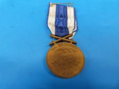A Czechoslovakian merit medal in case (with original paperwork)