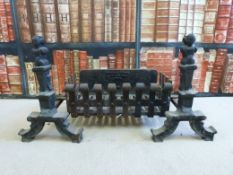 A cast iron fire grate with figural dogs