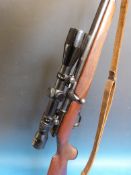 A Walker bolt action selective fire .22 rifle 34881 with Nikko Stirling 3 - 9 x 40 scope.  PLEASE