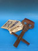 A mahogany stereoscope together with 34 various slides, many depicting village scenes etc