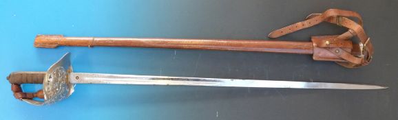 A Victorian Henry Wilkinson 1897 pattern Queen's Royal Regiment officer's sword in leather scabbard