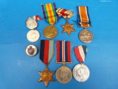 A WWI pair of medals awarded to 82623 GNR F.H. Hewett R.A. with some unrelated WWII medals and a