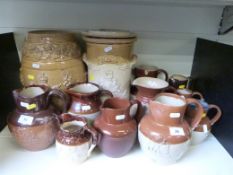 A collection of salt glazed stoneware jugs including Royal Doulton Victoria 1897 jug