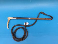A silver mounted horn and plaited leather riding crop (Ldn, Swaine & Adeney)