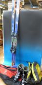 A set of skis and boots in bags