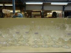 A large collection of cut glass drinking glasses and tableware to include wine glasses, ten