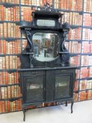 An Art Nouveau sideboard / display cabinet with mirror back, the base fitted with two drawers and