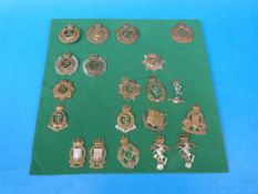 Twenty British Army badges including Medical Corps, Ordnance, Signals, Royal Engineers ER VIII, GR