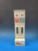 A vintage Self Serve Co Ltd 6d vending machine with labels for Aspro and Amplex