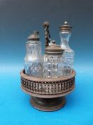 An unusual 19thC wooden finely pierced and carved cruet stand with bottles
