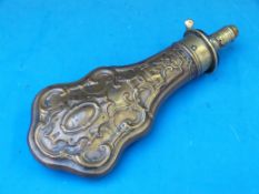 A Sykes patent brass powder flask with embossed decoration (21cm long)