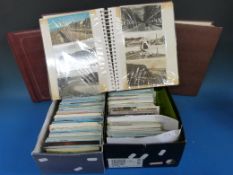 Three albums and two shoeboxes of postcards, most from the second half of the 20th century, mainly