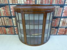A 19thC semi-circular cabinet, 94cm tall
