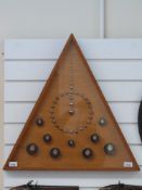 A triangular wall display of German / Goss steel balls (framed and glazed)