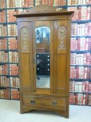 Two late C19th/early C20th satinwood wardrobes both with carved detail and drawers under. (Tallest
