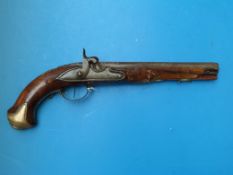 An I. C. Kuchenreiter continental percussion pistol with brass mounts and ornately carved stock,
