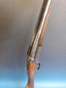 A Sabel 12 gauge side by side double barrelled shotgun, 26 inch barrels, serial number 318835.