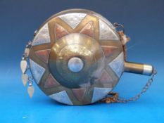A copper and silver inlaid brass water bottle