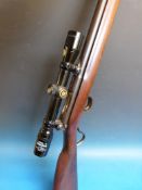 A Vickers .22 underlever rifle serial number V35741 with original model 10 - 4 x 32 scope.  PLEASE