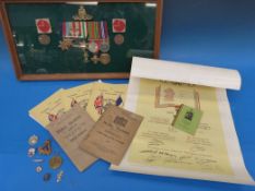 A set of WWII medals awarded to SL Pidden, in a glazed display case, comprising a 1939-45 Star,