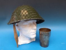 An R G A tankard awarded to gunner E J Short and dated 1918 together with a military helmet, post