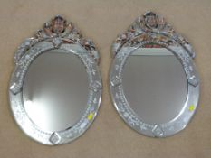 A pair of ornate hanging wall mirrors